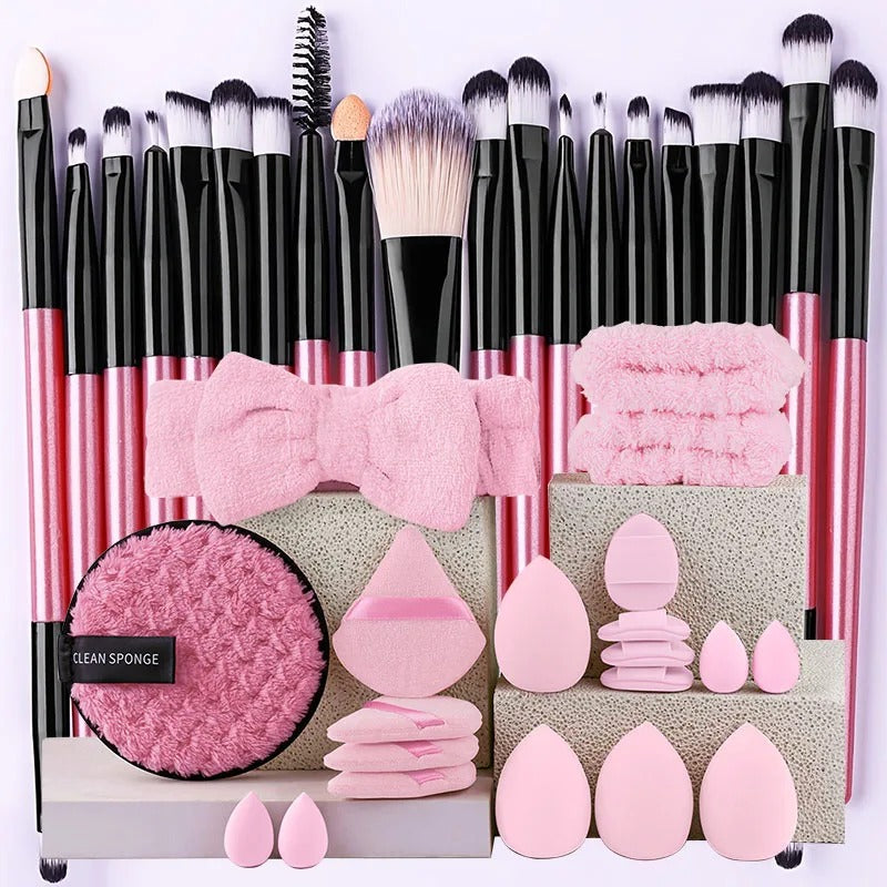 Pink makeup brush set with sponges, powder puffs and cleaning pad