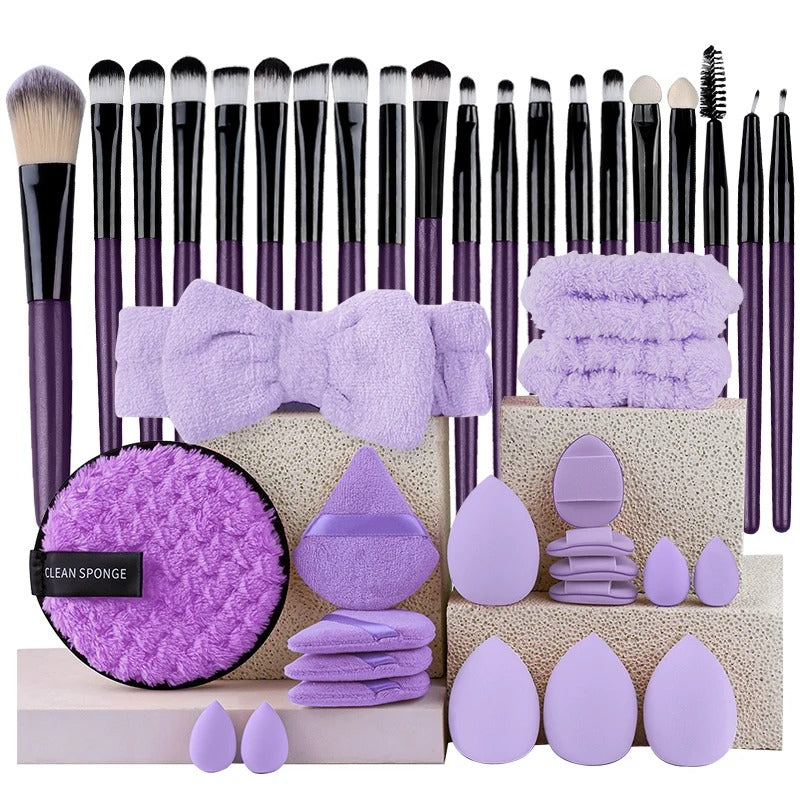Purple makeup brush set with matching sponges and headband