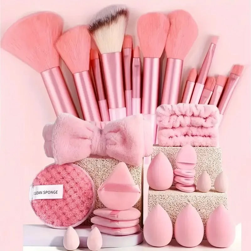 Pink 33-piece makeup brush set with sponges, powder puffs, headband and cleaning pad