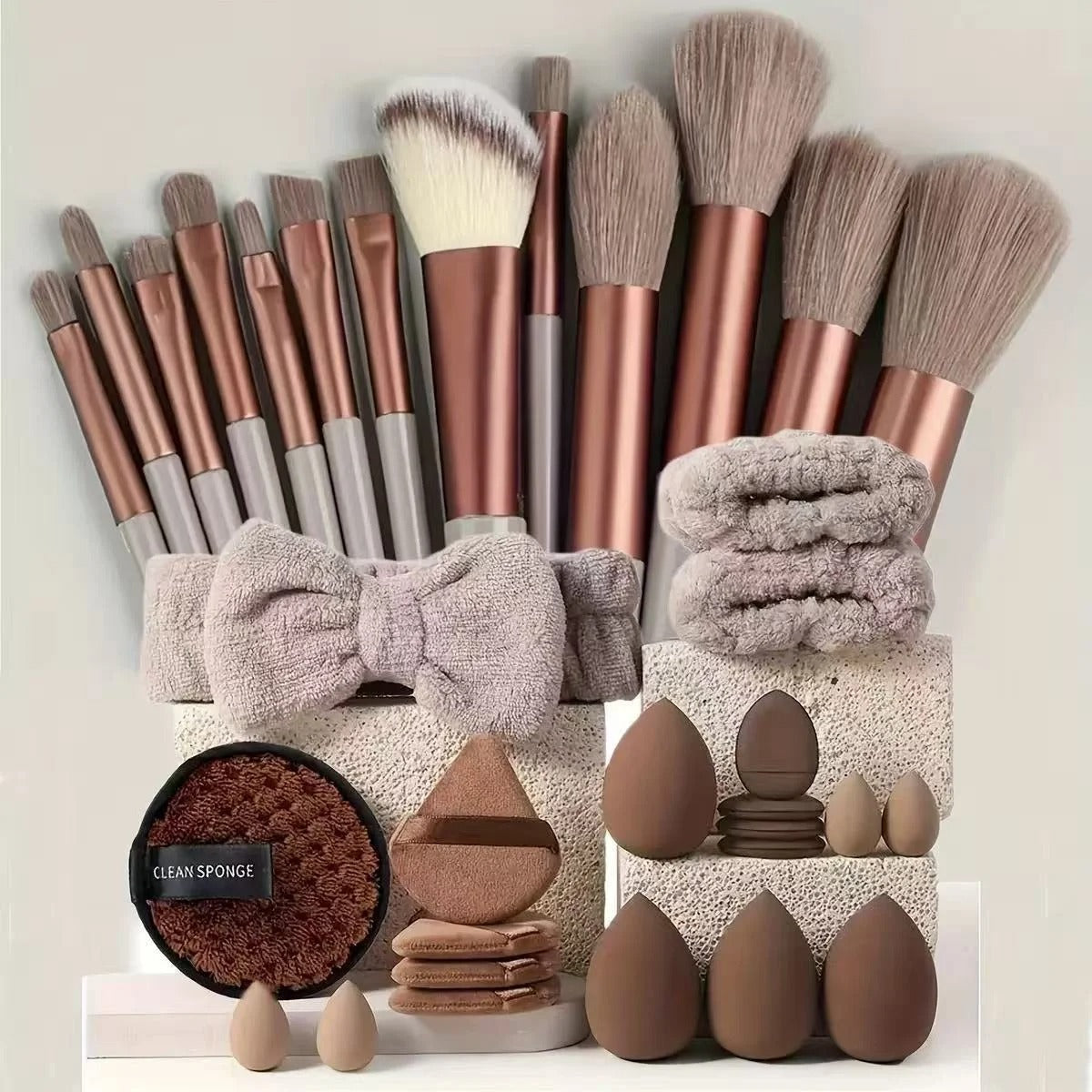 Brown 33-piece makeup brush set with matching sponges, puffs and headband