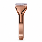 Curved foundation brush with rose gold handle on a white background