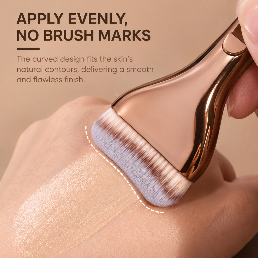Curved brush blending foundation on the back of a hand with no brush marks